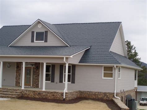 color ideas for house with grey metal roof|homes with dark gray roofs.